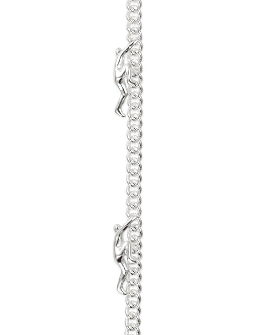 close up of the Can't Hold Me Down bracelet in silver featuring figures climbing up the chain