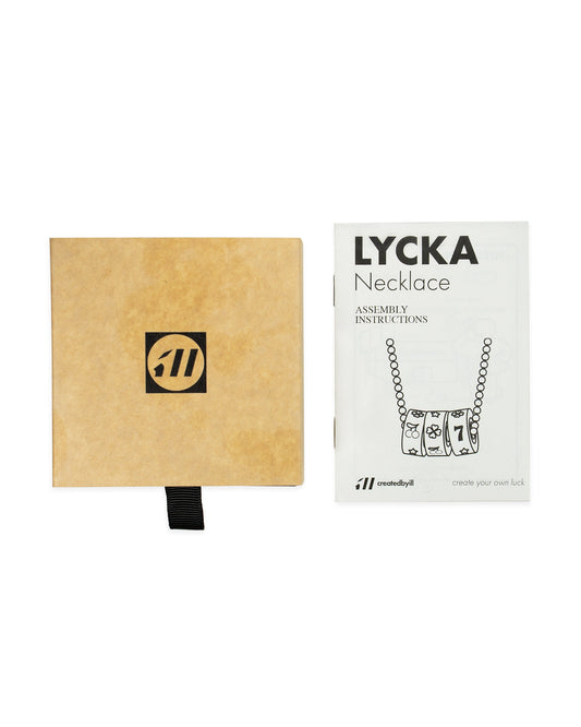 Lycka Necklace packaging with assembly instructions product photography
