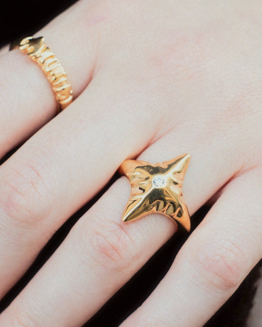 Star Ring in gold with Cupid Ring in gold worn