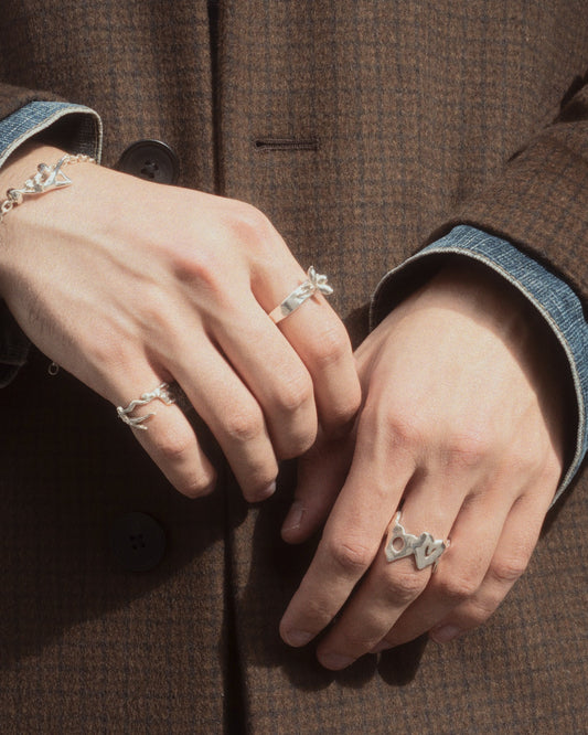 love ya ring in silver worn with other rings