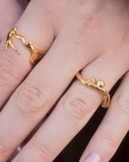 Sisyphus Ring worn in gold