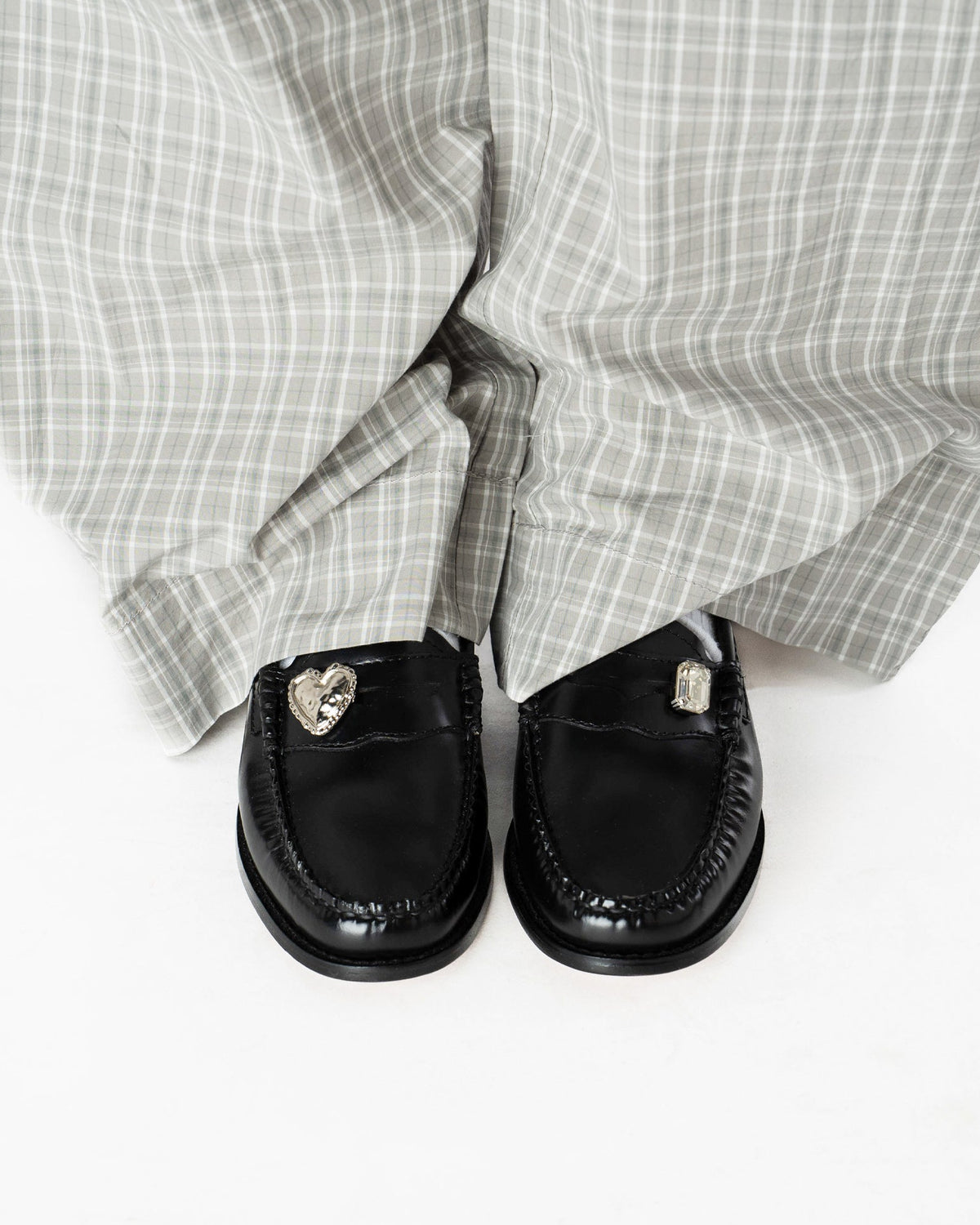 Heart Penny Pins on a pair of penny loafer wearing them in a front view