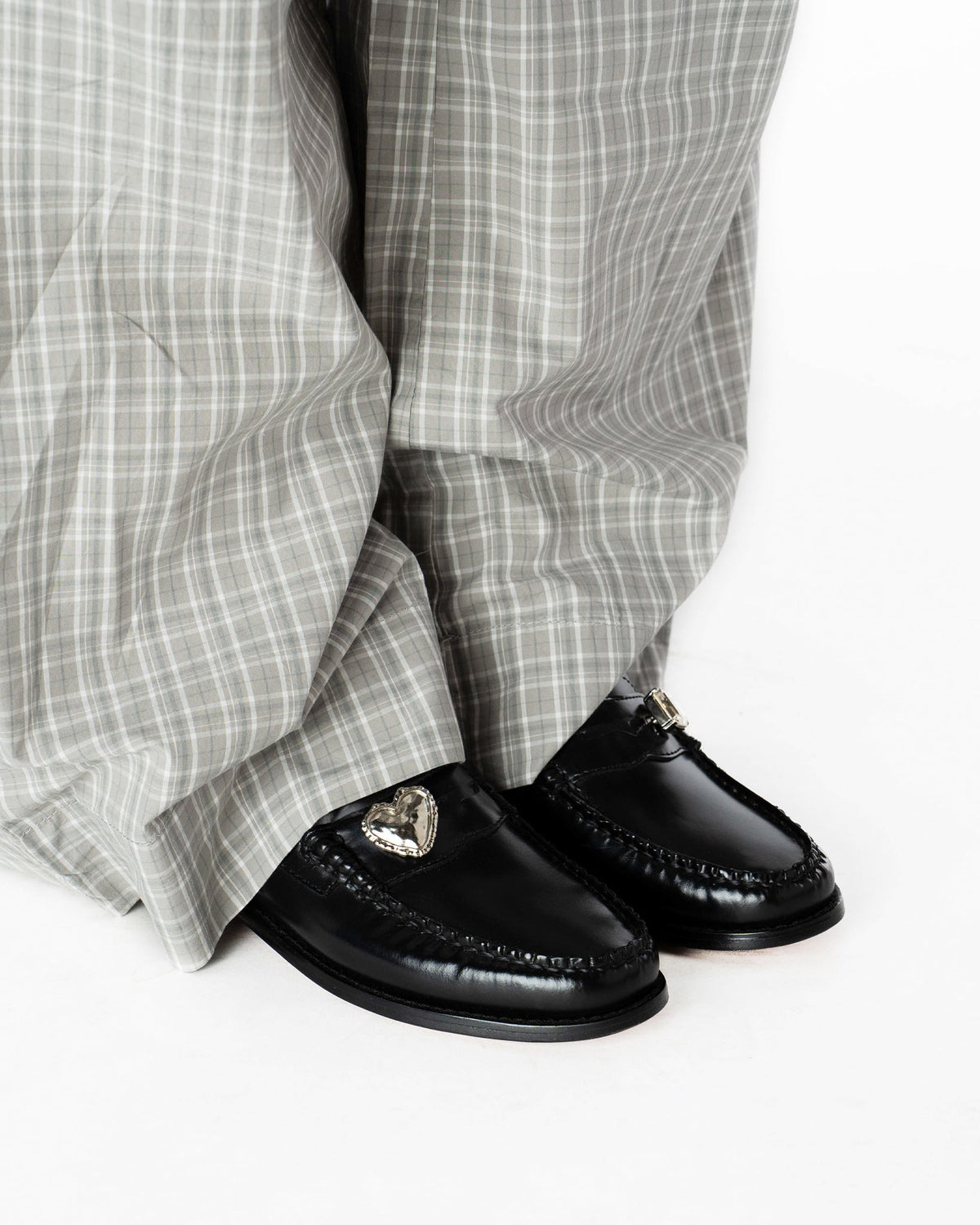 Heart Penny Pins on a pair of penny loafer wearing them in a side view