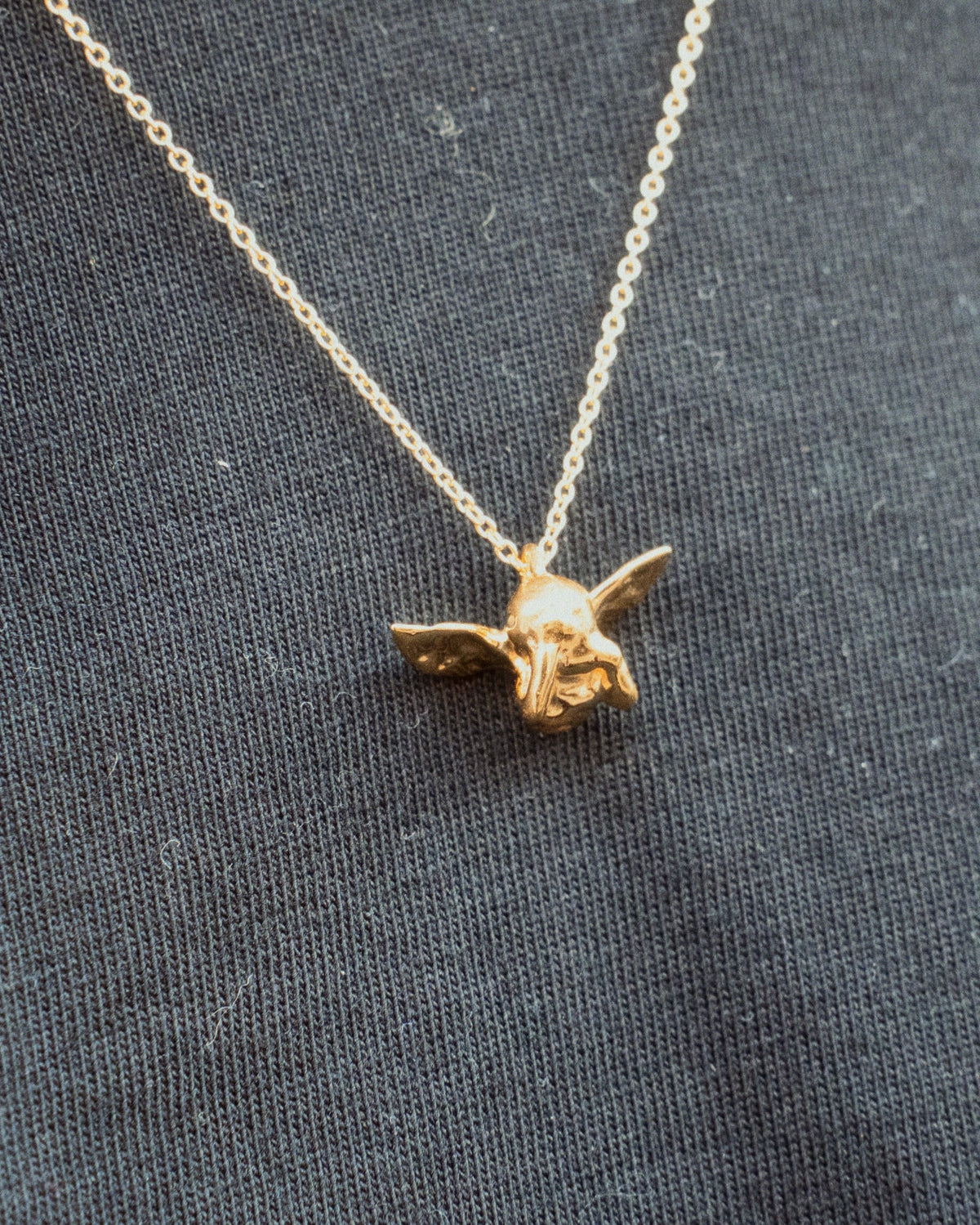 Cupid Necklace closeup in gold