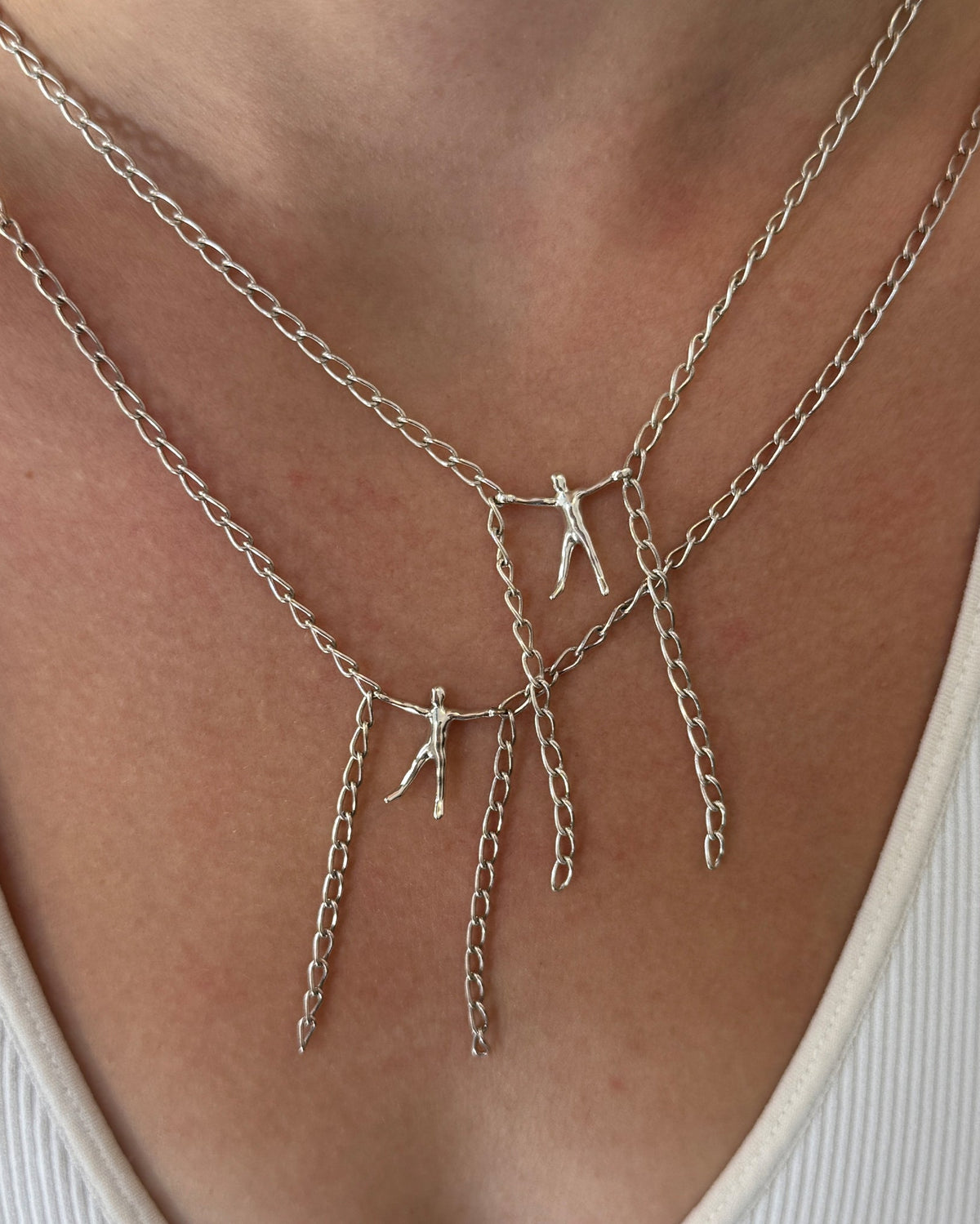 two Hang By A Thread necklaces worn by female