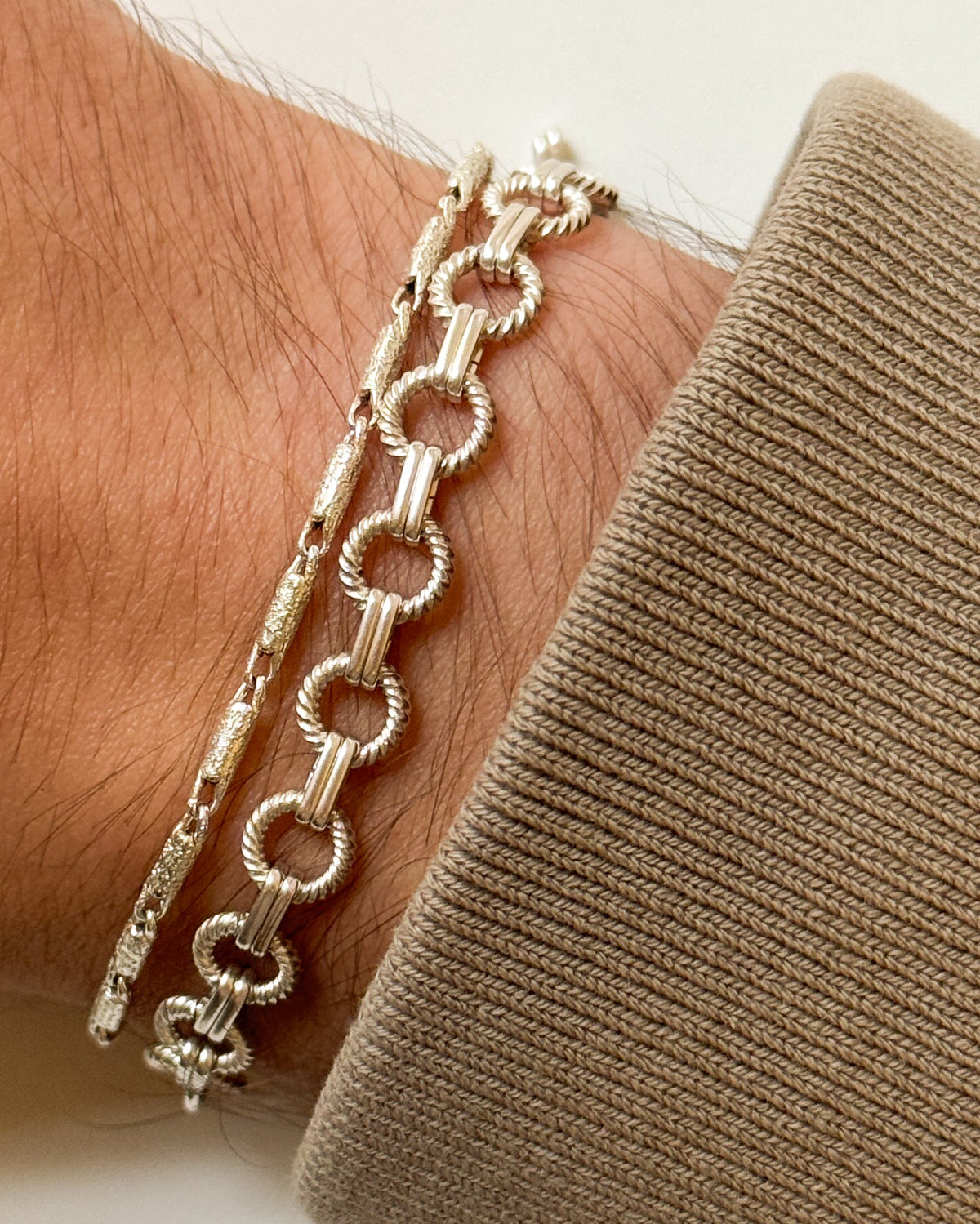 sun bracelet worn next to pen bracelet