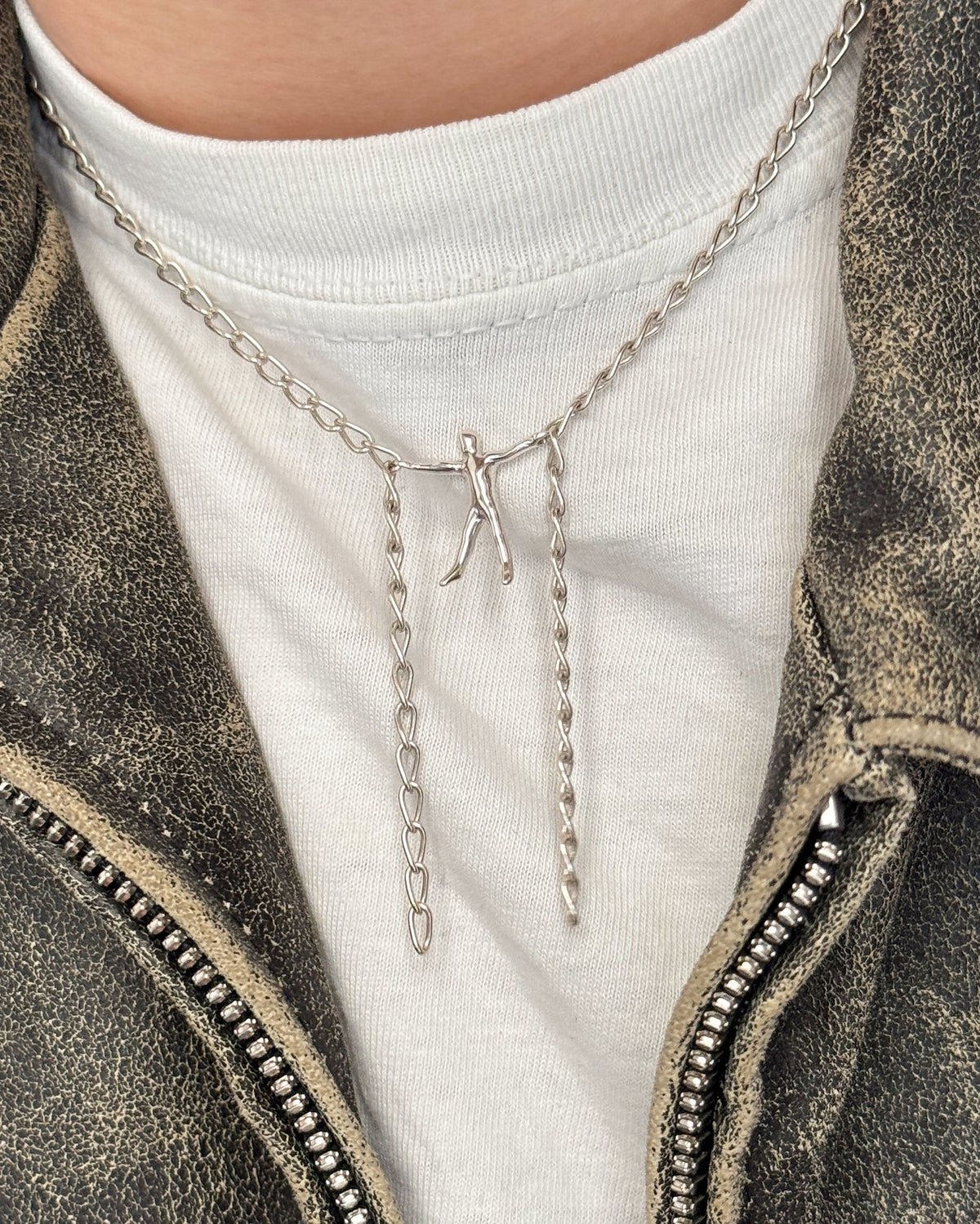 Hang By A Thread Necklace in silver worn with a white tshirt and leather jacket
