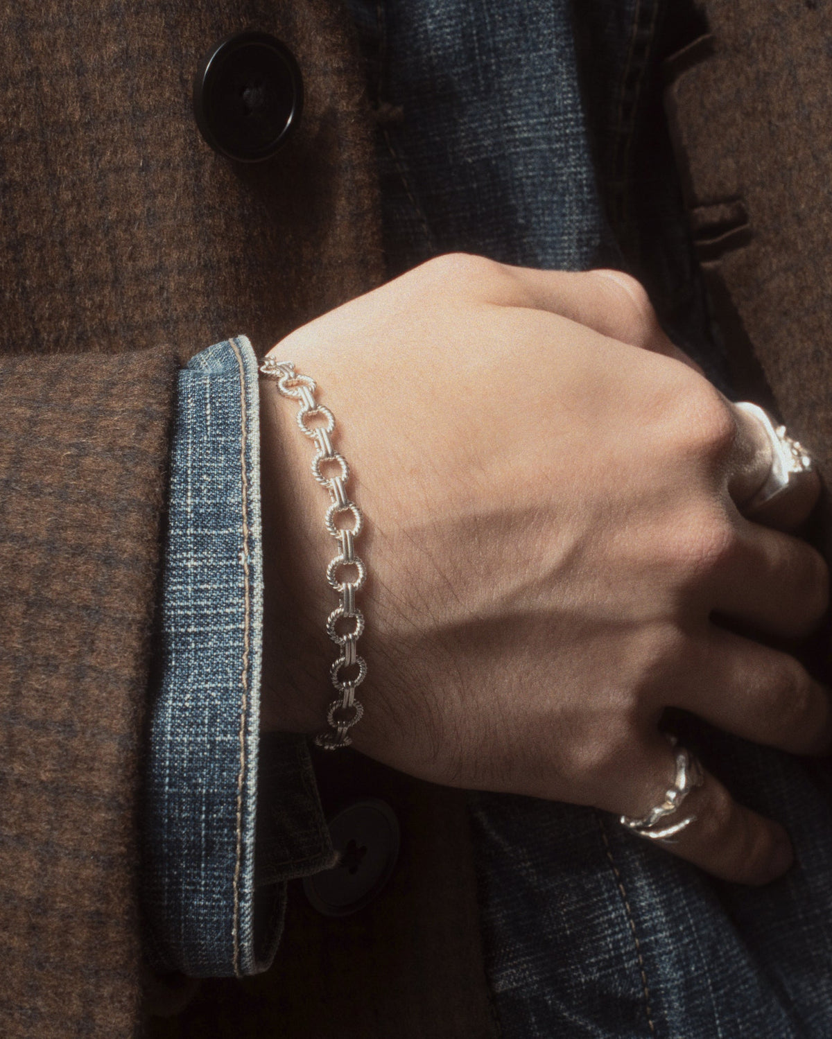 Sun Bracelet worn with coat and jean jacket