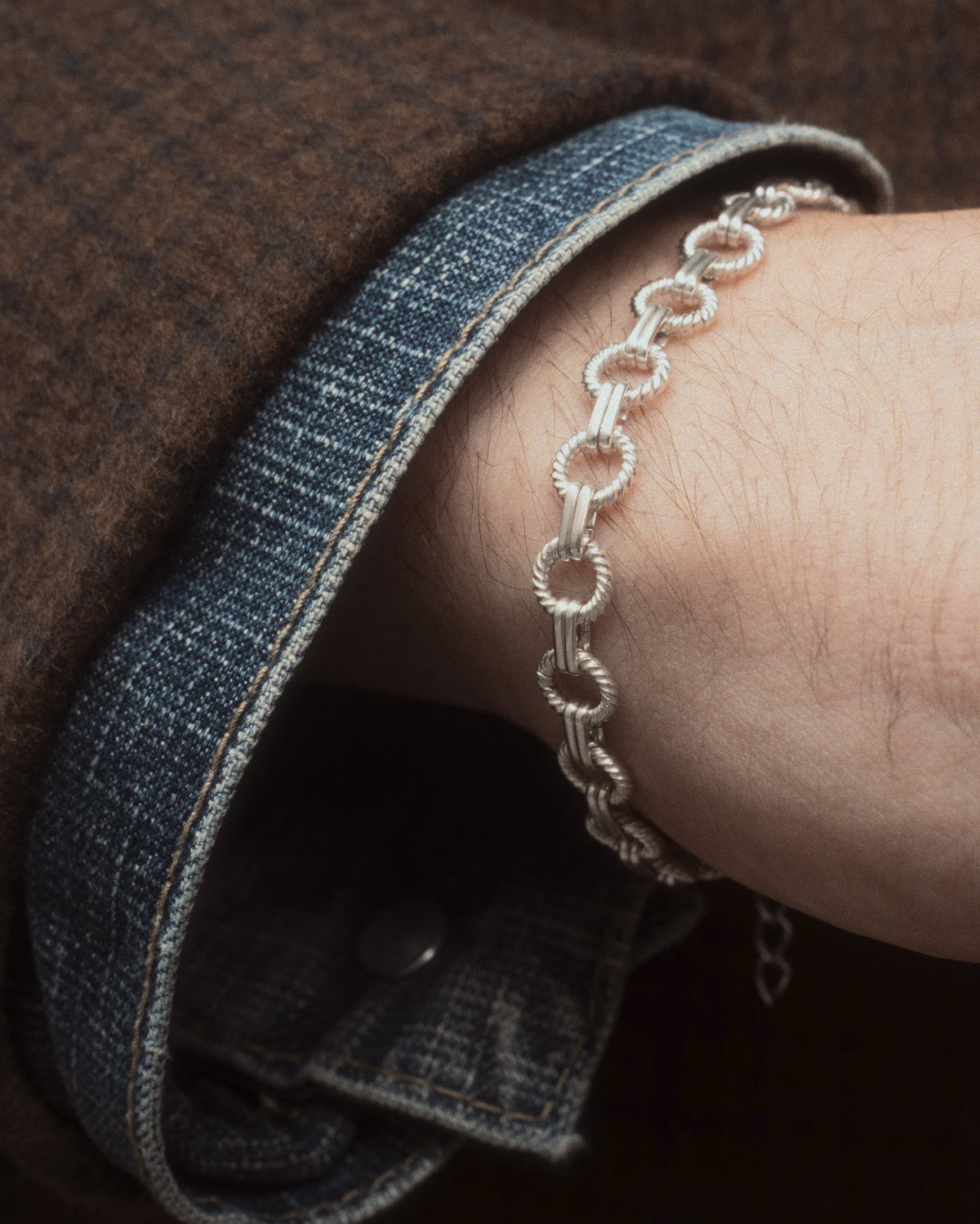 Sun Bracelet worn with coat and jean jacket