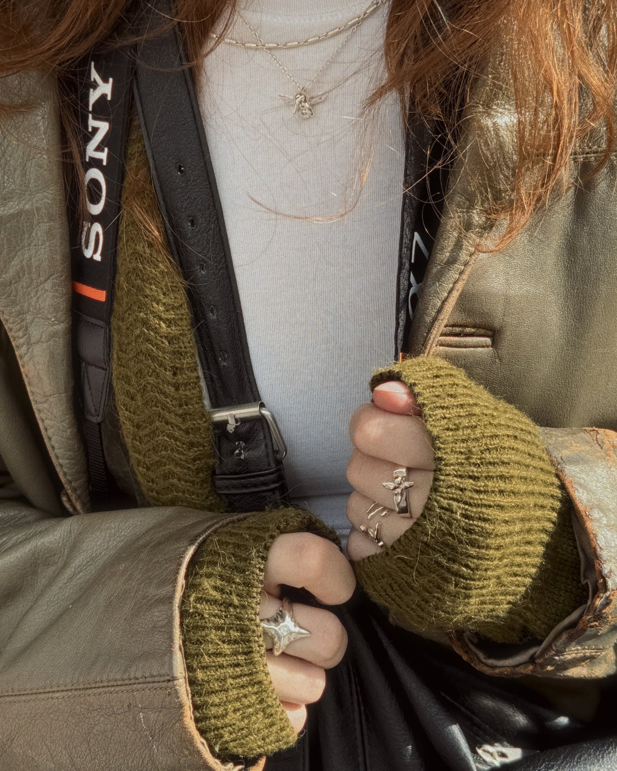 Pen Necklace worn with green leather jacket