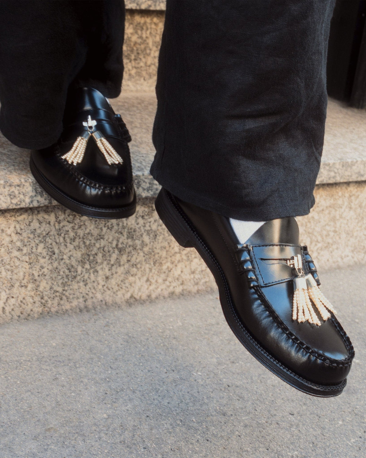 pearl tassel penny pins being worn on penny loafer while going down stair
