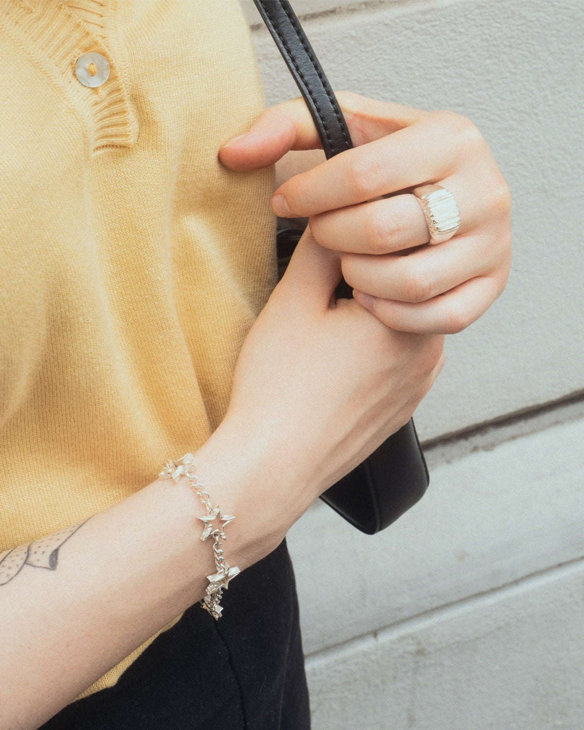Daydream Ring in silver worn by female in yellow top