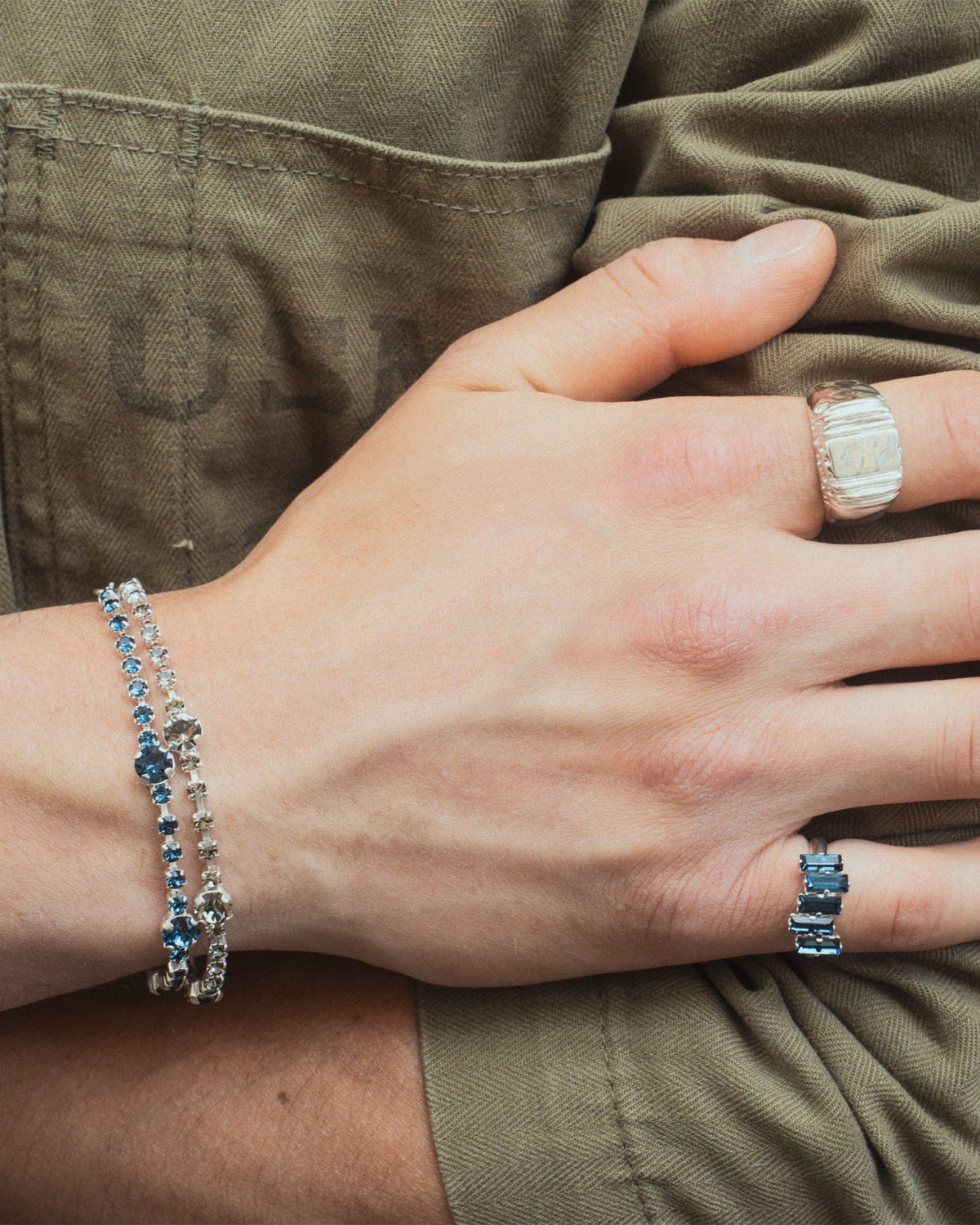 Daydream Ring in silver worn by male with other jewelry