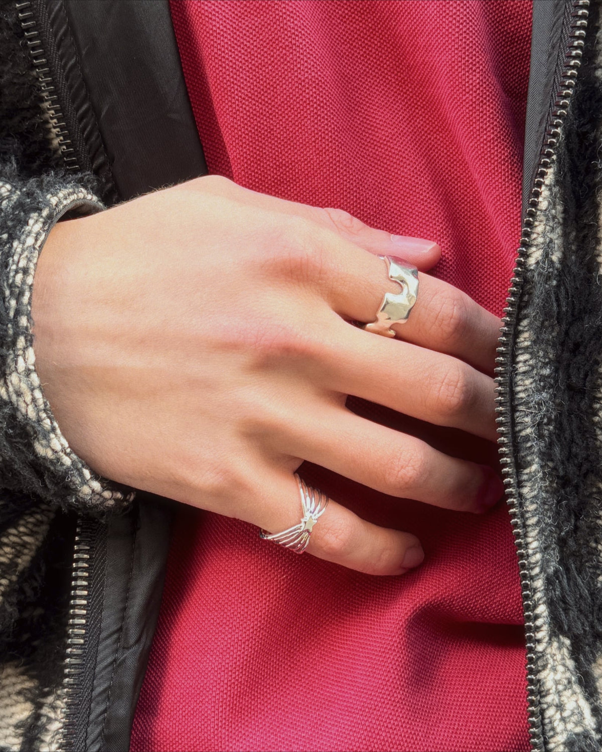 Shine Ring worn in silver with a red shirt